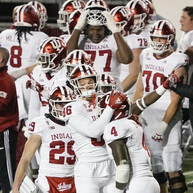 Indiana players celebrate in the final seconds of an NCAA college football game against Wisconsin